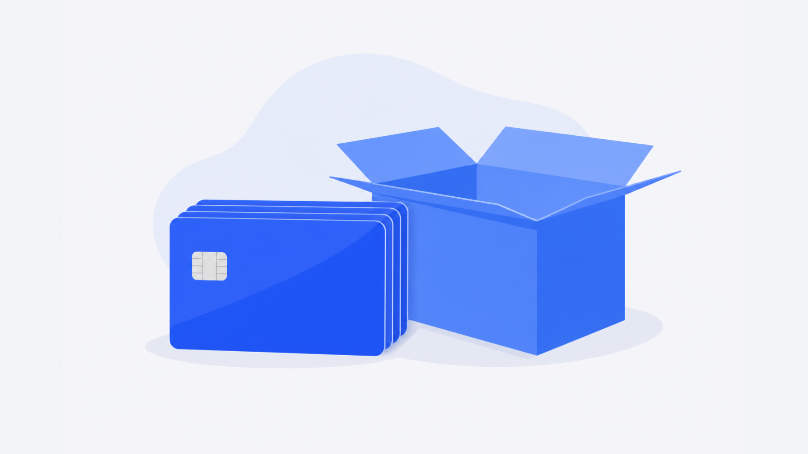 A stack of blank cards beside an open shipping carton