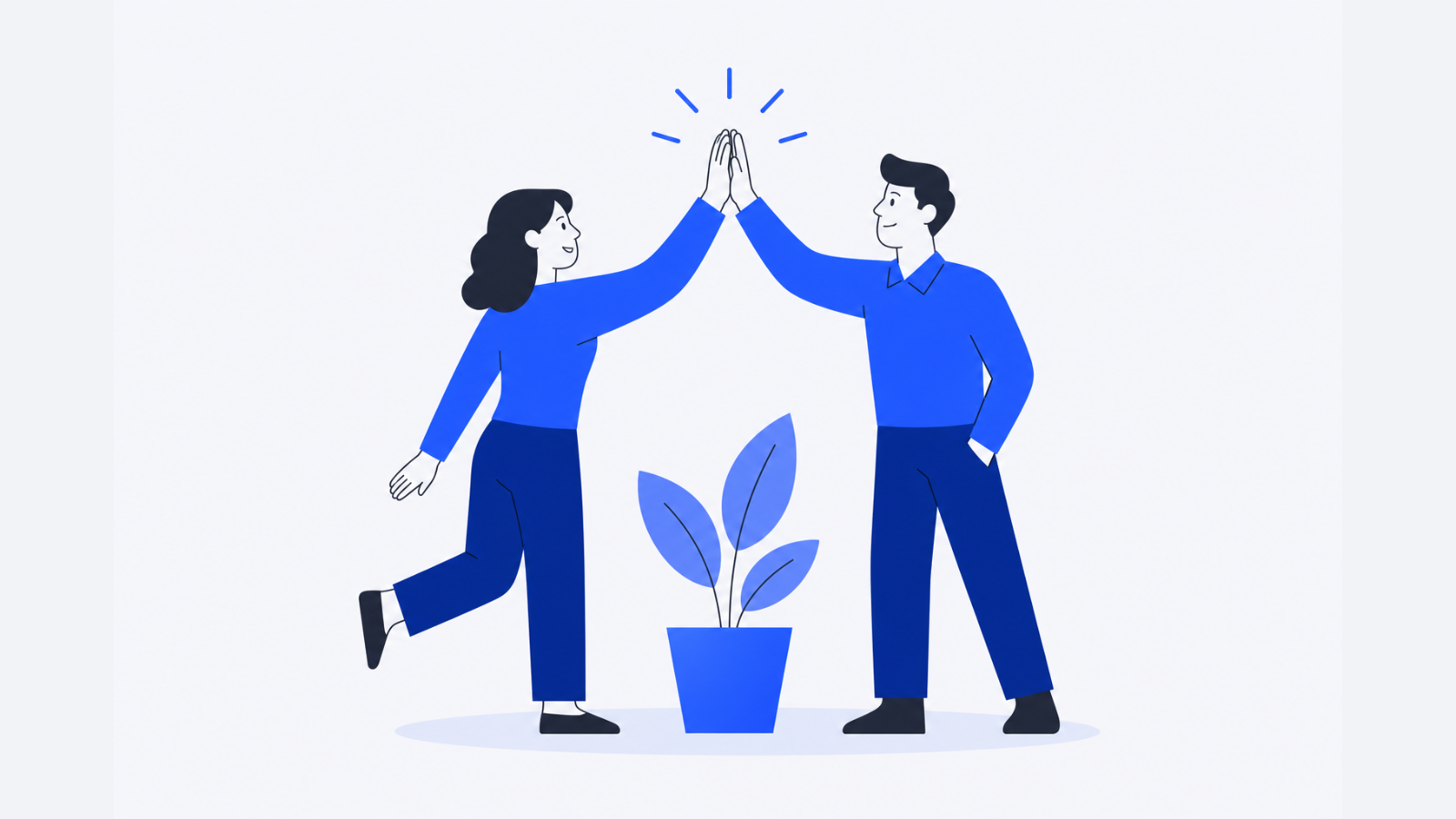 Two coworkers exchange a high-five beside a potted plant