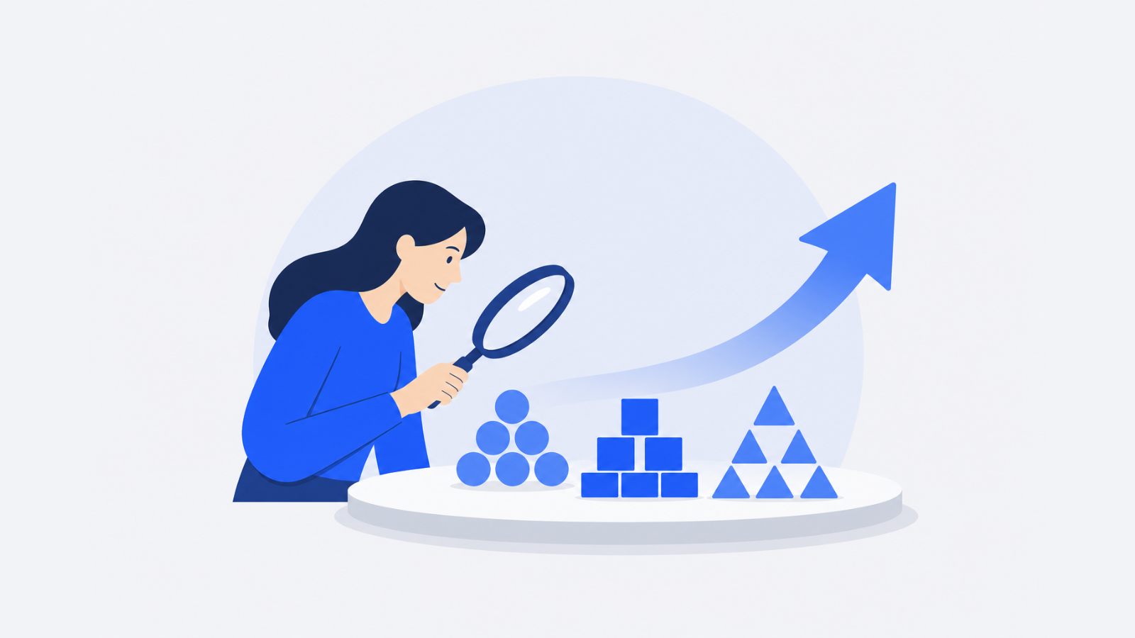 A researcher examines grouped shapes on a table beside a magnifying glass and an upward arrow